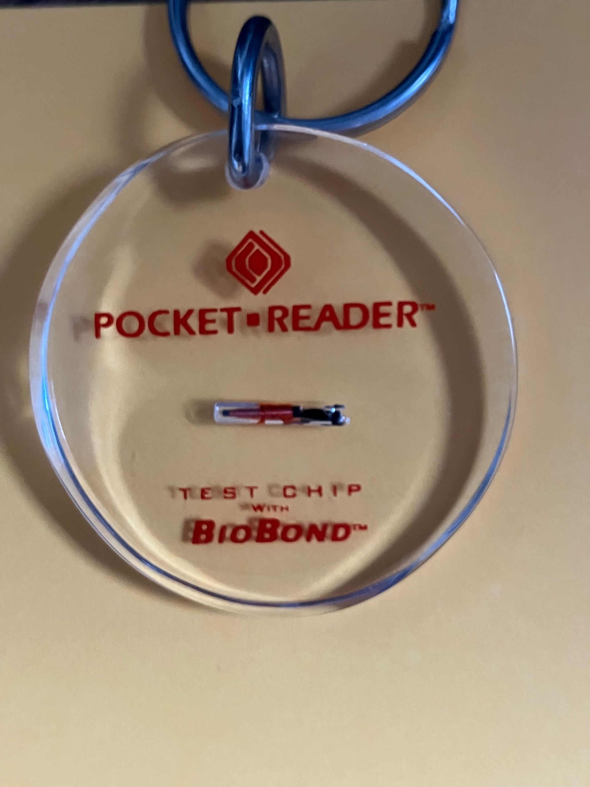 Pet Microchip encased in plastic to show size of microchip